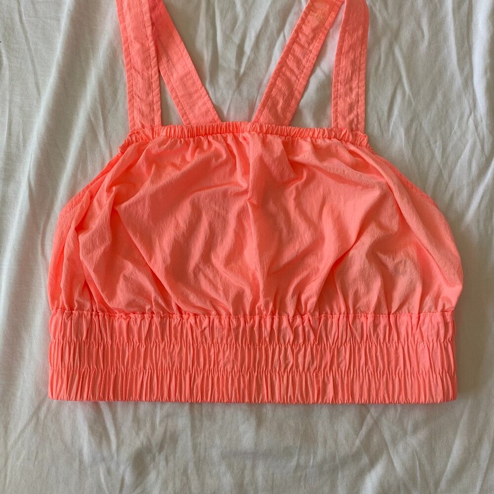 FP Movement Cropped work out top Lightweight material in neon orange. Size:S